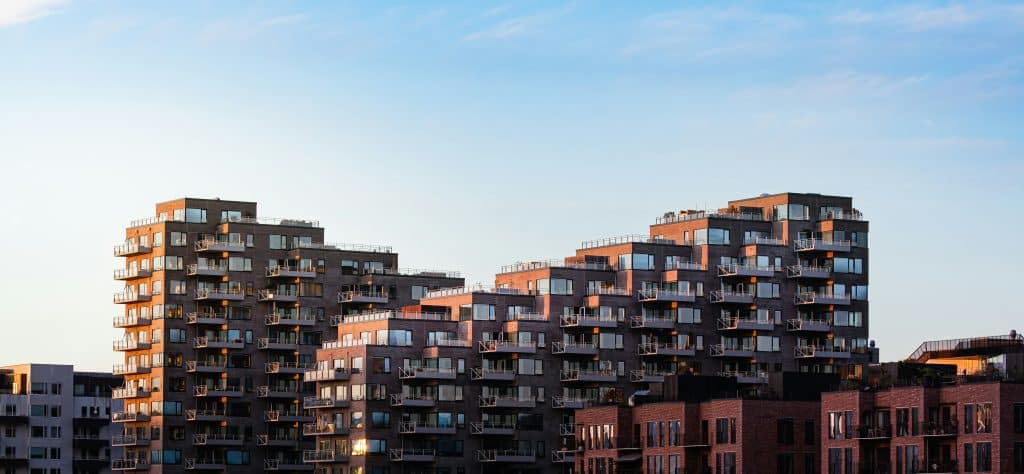 Modern multifamily residential complex at sunset, used as an illustrative image for the U.S. housing and rental market