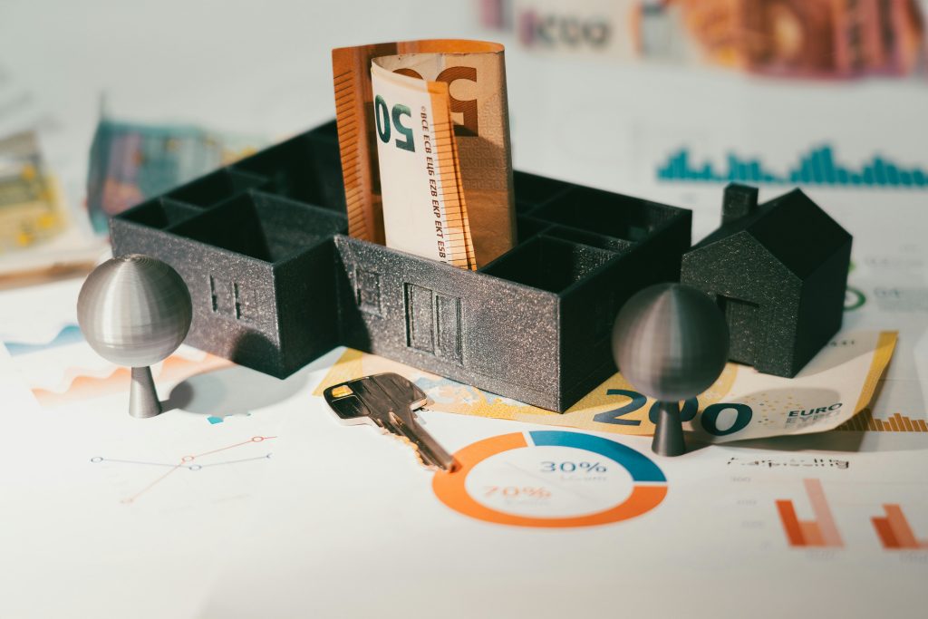 House model, mortgage documents and financial analysis materials