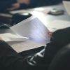 Mortgage professional reviewing documents, illustrating UWM's Underwriting+ program