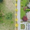 Aerial view of a detached house and surrounding residential property