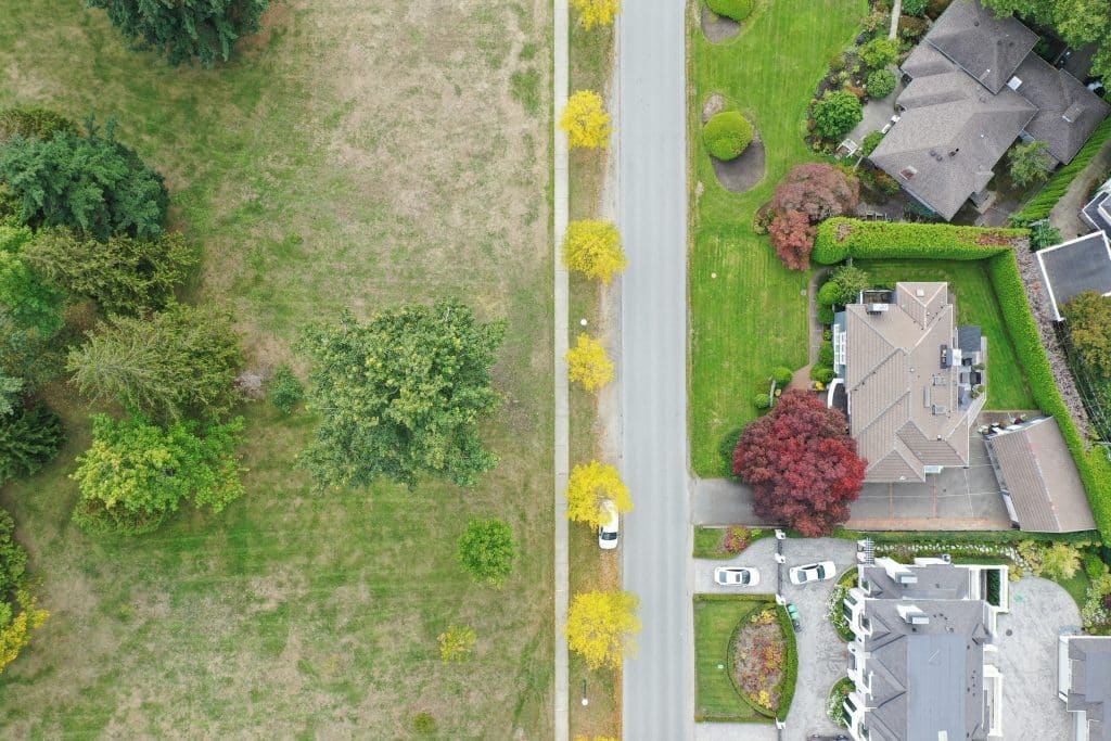 Aerial view of a detached house and surrounding residential property