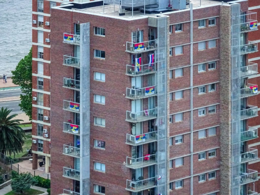 Multistory apartment building with balconies, illustrating urban multifamily ownership