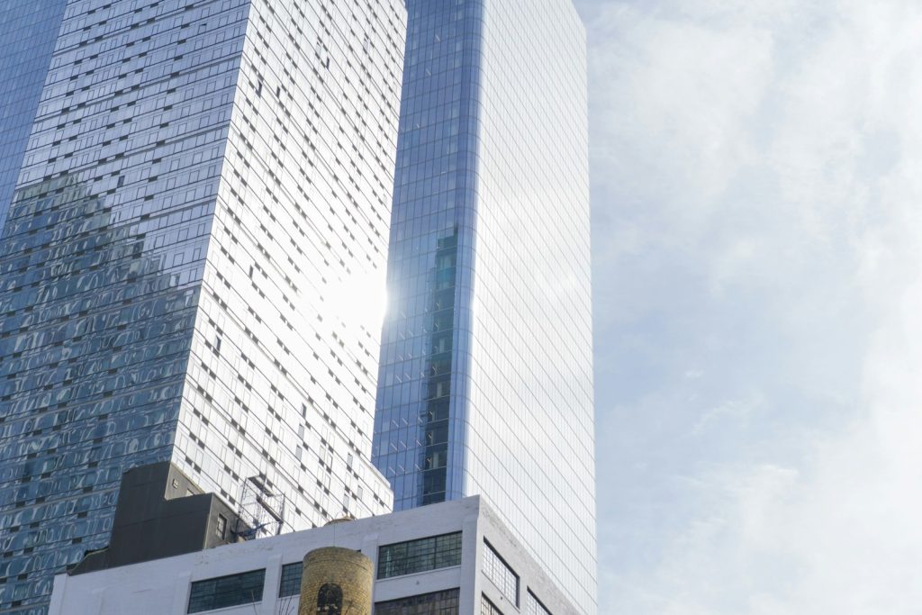Modern commercial skyscrapers in daylight, illustrative for institutional real estate investment
