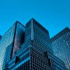 Modern commercial office towers photographed from below; illustrative image, not a CBRE property