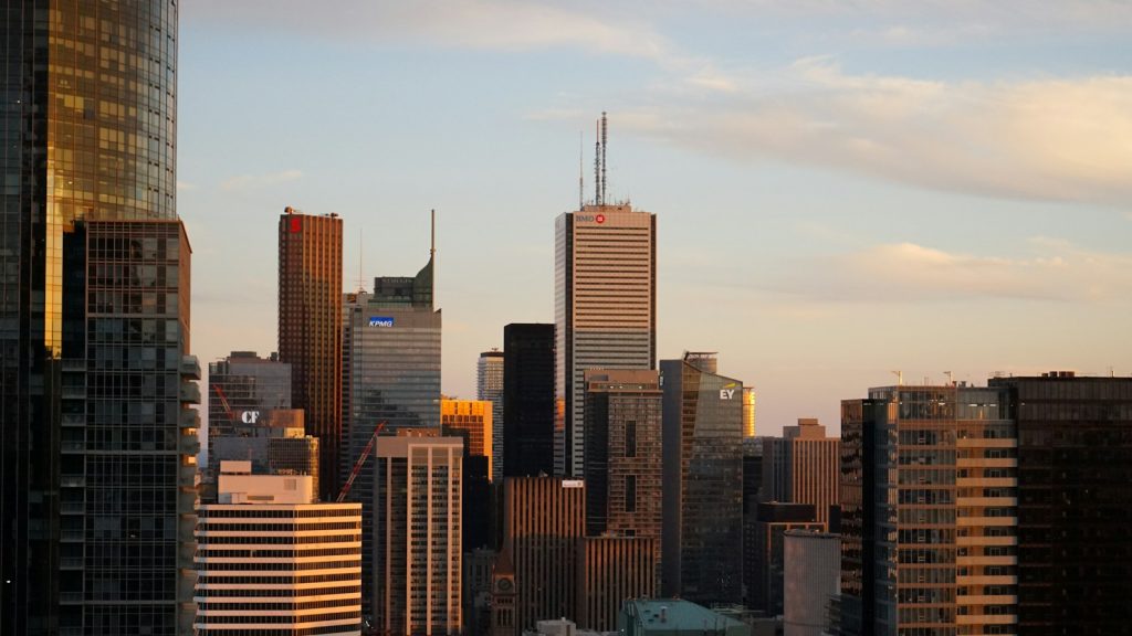 Illustrative photograph of commercial office towers for real estate lending merger news