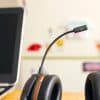 Headset next to a laptop computer, illustrating remote mortgage borrower service