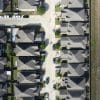 Aerial view of residential neighborhood illustrating homebuilder consolidation; representative photo
