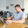 Professional using laptop in a bright office