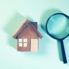 House model and magnifying glass illustrating FHA appraisal modernization and UAD 3.6