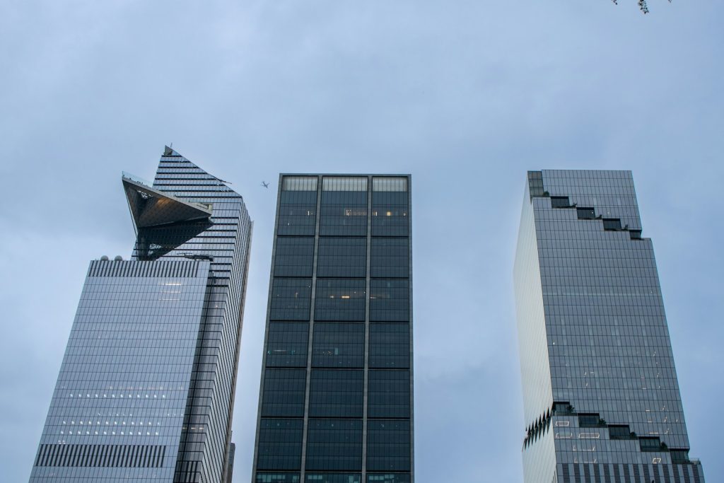 Financial district office towers illustrating mortgage lender leverage and capital market risks
