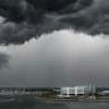 Dark storm clouds over Port Canaveral, Florida; illustrative image, not a photograph of Hurricane Isaias