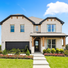 Two-story brick home pictured on HistoryMaker Homes' Dallas-Fort Worth website