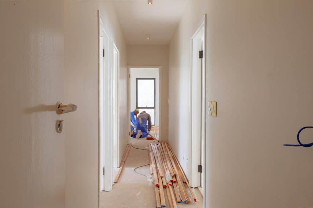 Two workers renovating a residential home