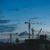 Construction cranes illustrating the relationship between financing costs and housing supply.