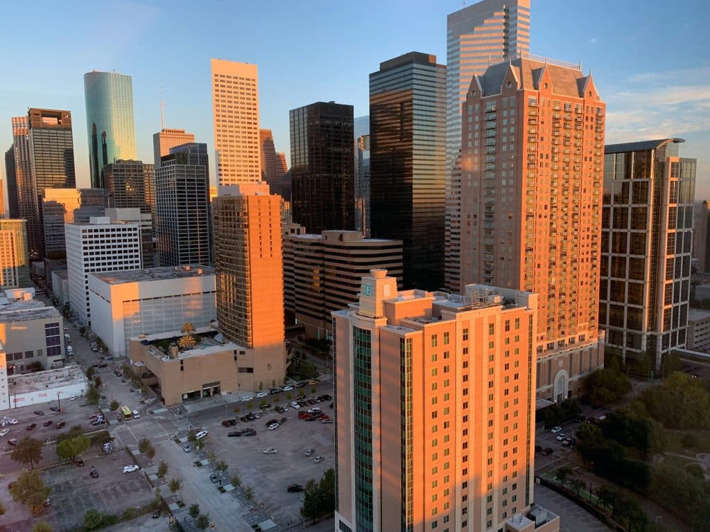 Downtown Houston skyscrapers at sunset illustrating commercial real estate lending in Texas