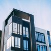 Modern apartment building exterior, illustrating housing discrimination and rental access