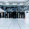 Illustrative photograph of a modern data center equipment hall; not a Nebius facility. Photo by Taylor Vick on Unsplash.