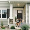 Family outside a residential home, illustrative