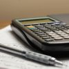 Calculator and pen on papers, illustrating mortgage income document verification