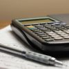 Illustrative photograph of calculator and documents accompanying mortgage fraud indictment report