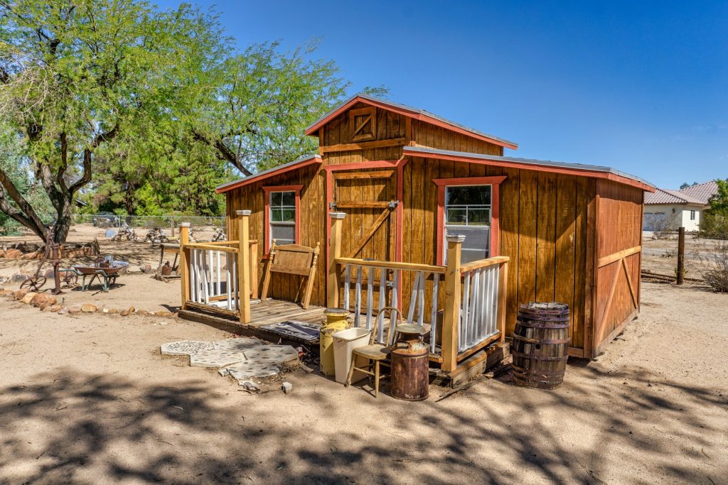 Illustrative small wooden home, not identified as a Cavco manufactured home