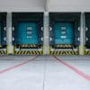 Colorful industrial loading doors at a commercial property; illustrative photograph, not a STAG asset