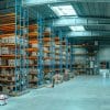 Large industrial building and loading facilities, illustrating net-lease property investment
