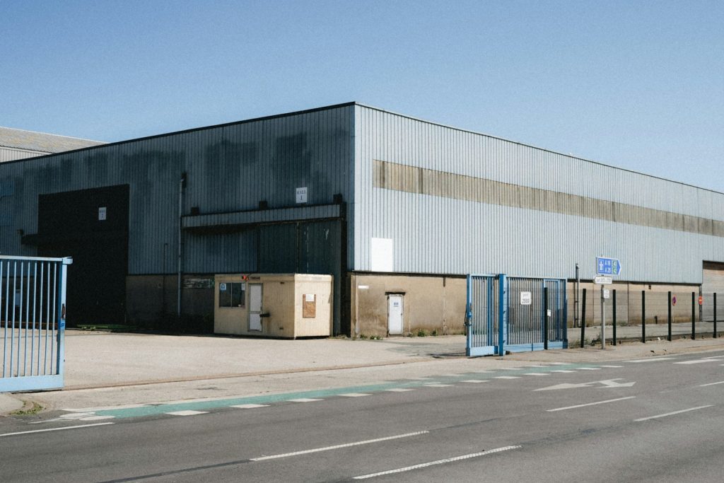 Large industrial distribution warehouse exterior, illustrative image