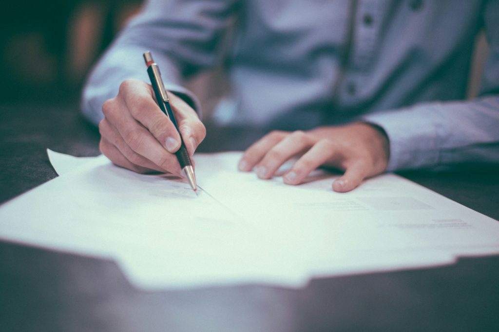 Pen on paperwork, illustrative image for fraudulent property deed filings