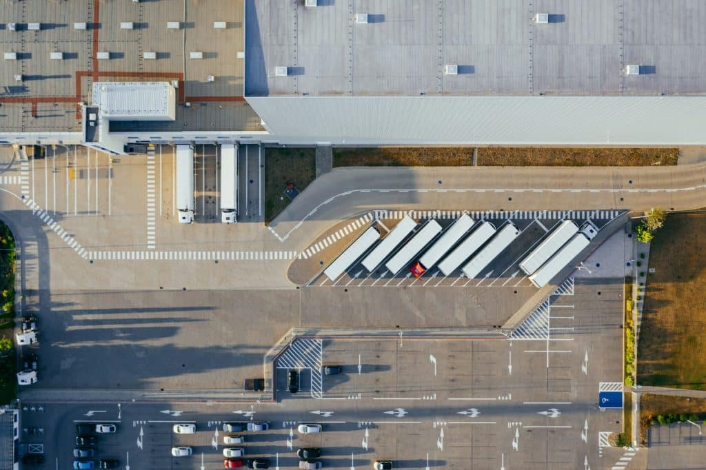 Aerial view of a commercial logistics area, illustrating institutional real estate investment