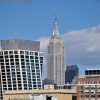 Midtown Manhattan skyline illustrating the Rithm Capital and DRA Advisors office joint venture