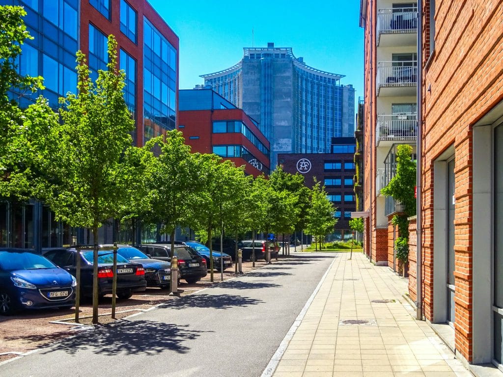 Illustrative modern mixed-use buildings; not The Orchard in Pearland.