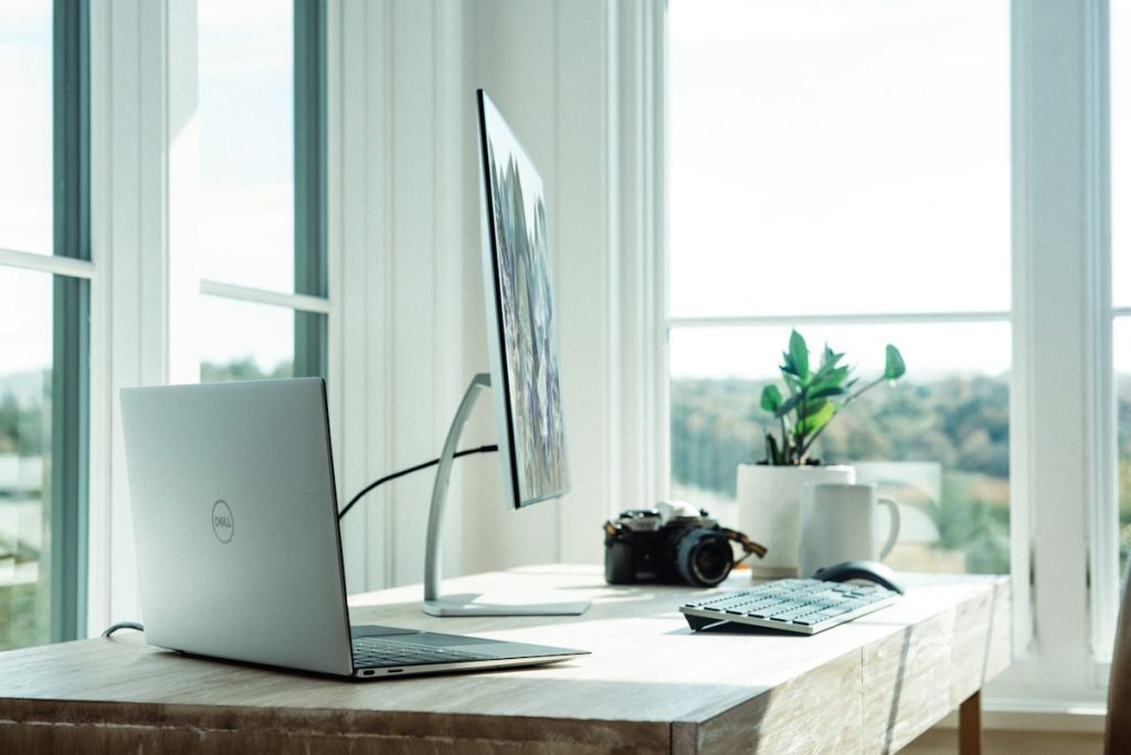 Computer workstation illustrating artificial intelligence tools for commercial real estate loan analysis