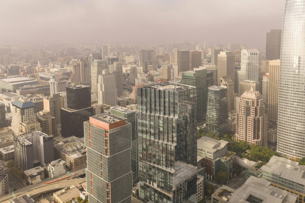 Dense city skyline with commercial towers illustrating property brokerage and capital markets