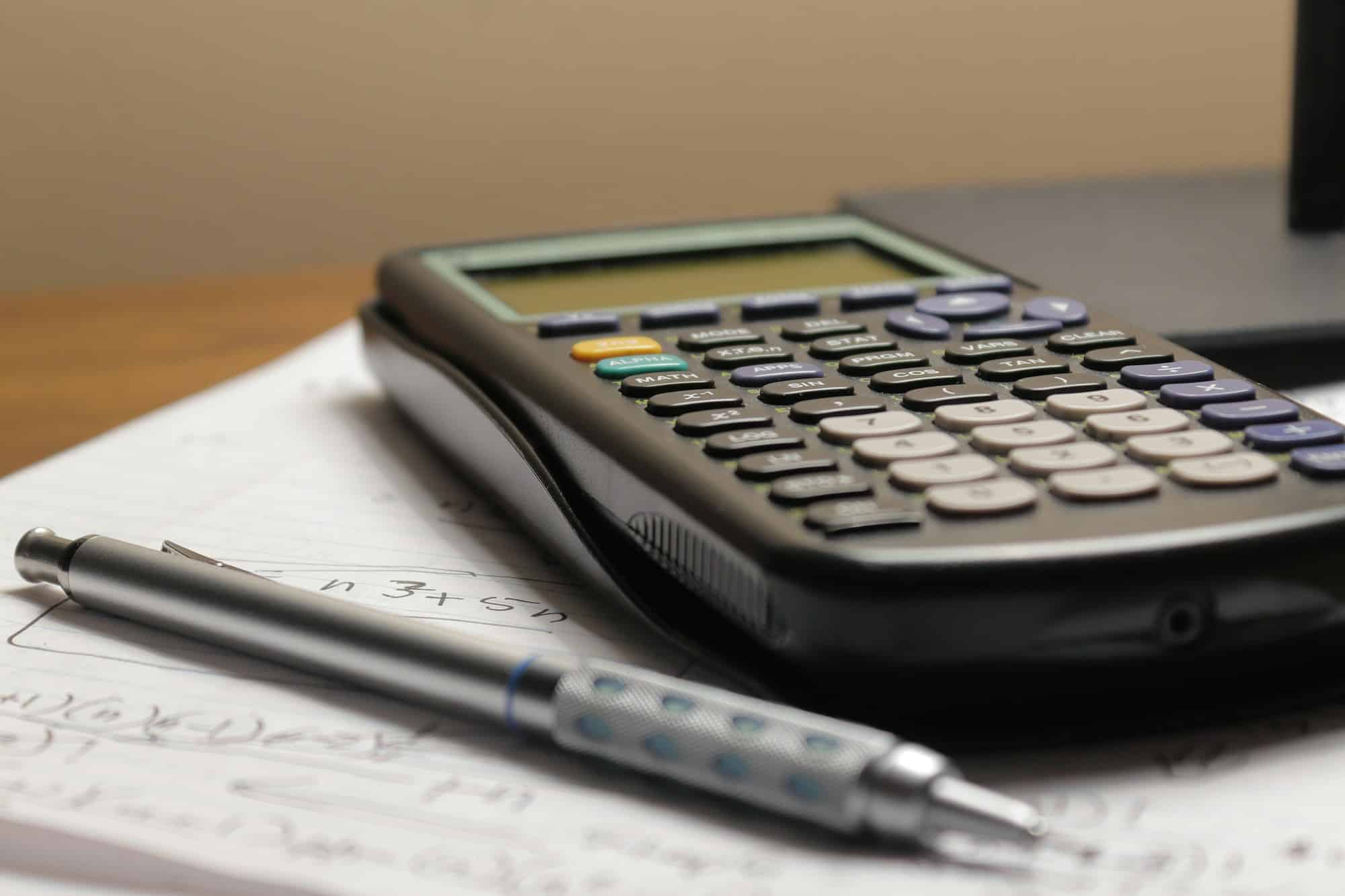 Calculator and mortgage documents, illustrative photograph