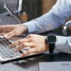 Person working at laptop, illustrating mortgage technology operations; not an ICE facility