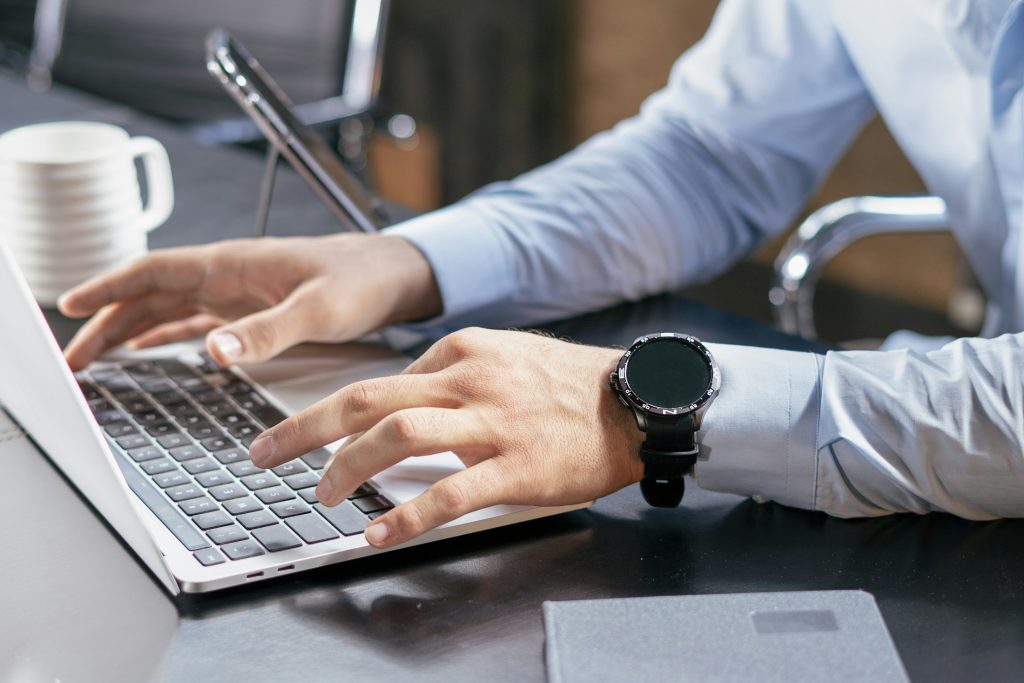 Person working at laptop, illustrating mortgage technology operations; not an ICE facility