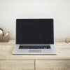 Laptop on desk, representative of mortgage software