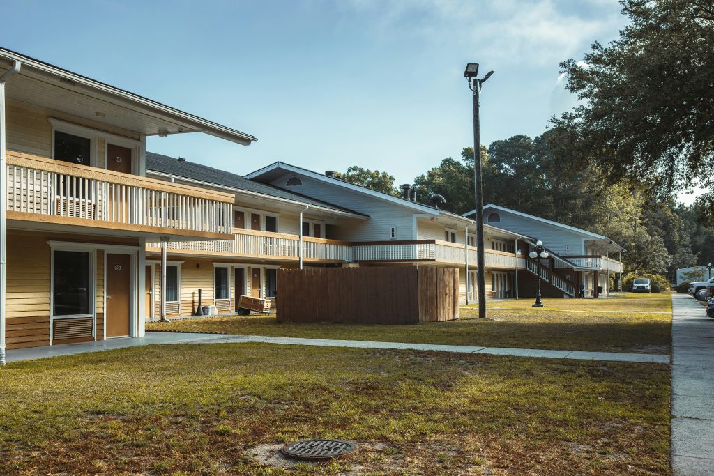 Senior housing community exterior illustrating National Health Investors' six-community acquisition