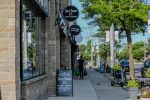 Neighborhood retail storefronts illustrating Phillips Edison grocery-anchored shopping center investment