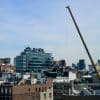 Building construction crane in New York City; illustrative photograph, not the 2185 Coyle Street site