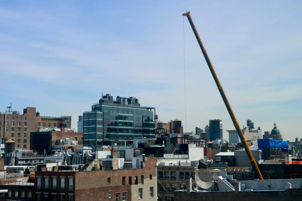 Building construction crane in New York City; illustrative photograph, not the 2185 Coyle Street site