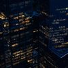 New York City commercial buildings at night, illustrative image for federal securities litigation; not Compass headquarters