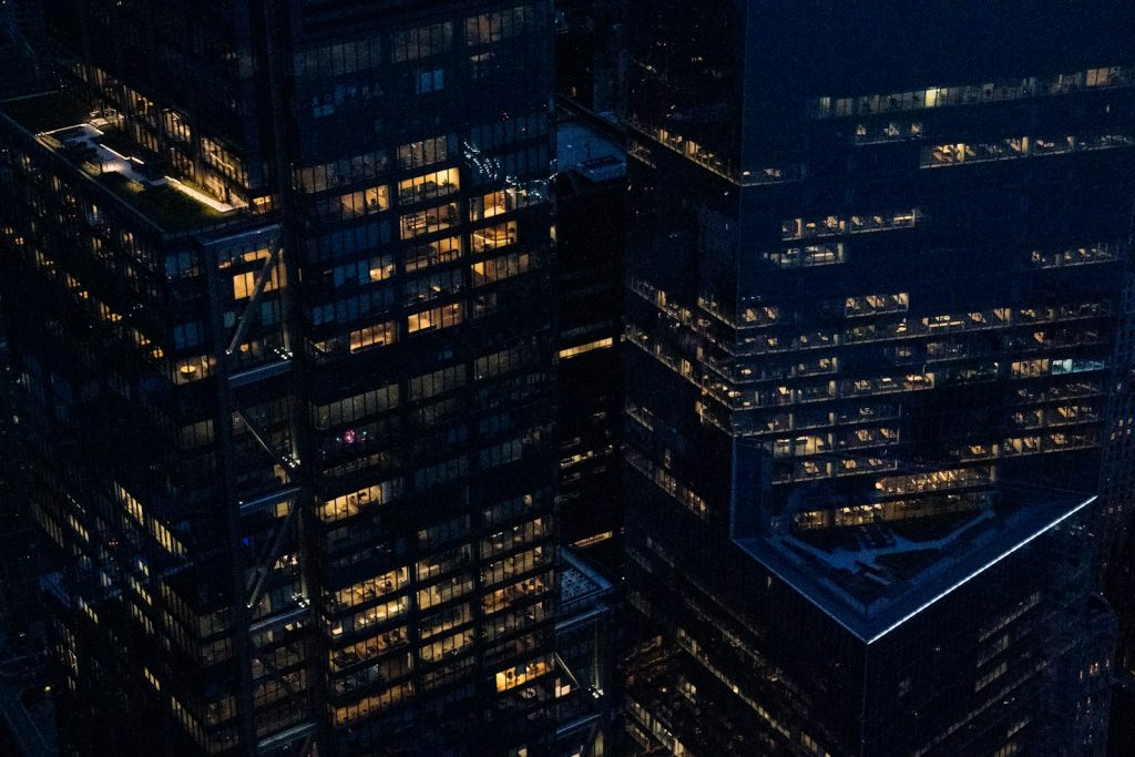 New York City commercial buildings at night, illustrative image for federal securities litigation; not Compass headquarters