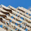 Wooden framing and roof trusses at a new-home construction site, illustrating pressures on U.S. housing supply
