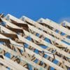 Timber and roof trusses on a home under construction, illustrating residential land development