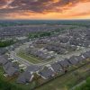 Aerial view of a suburban new-home development, illustrating national homebuilder demand