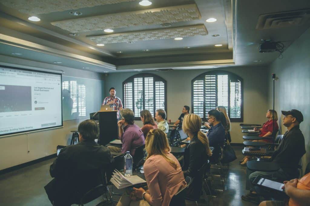 Audience attending a professional training session; illustrative image, Quilia / Unsplash