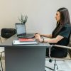 Real estate professional working at laptop, illustrative technology image