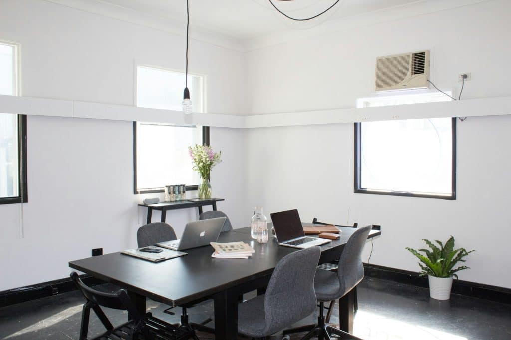 Contemporary office meeting space illustrating brokerage operations; not The Agency Spokane location